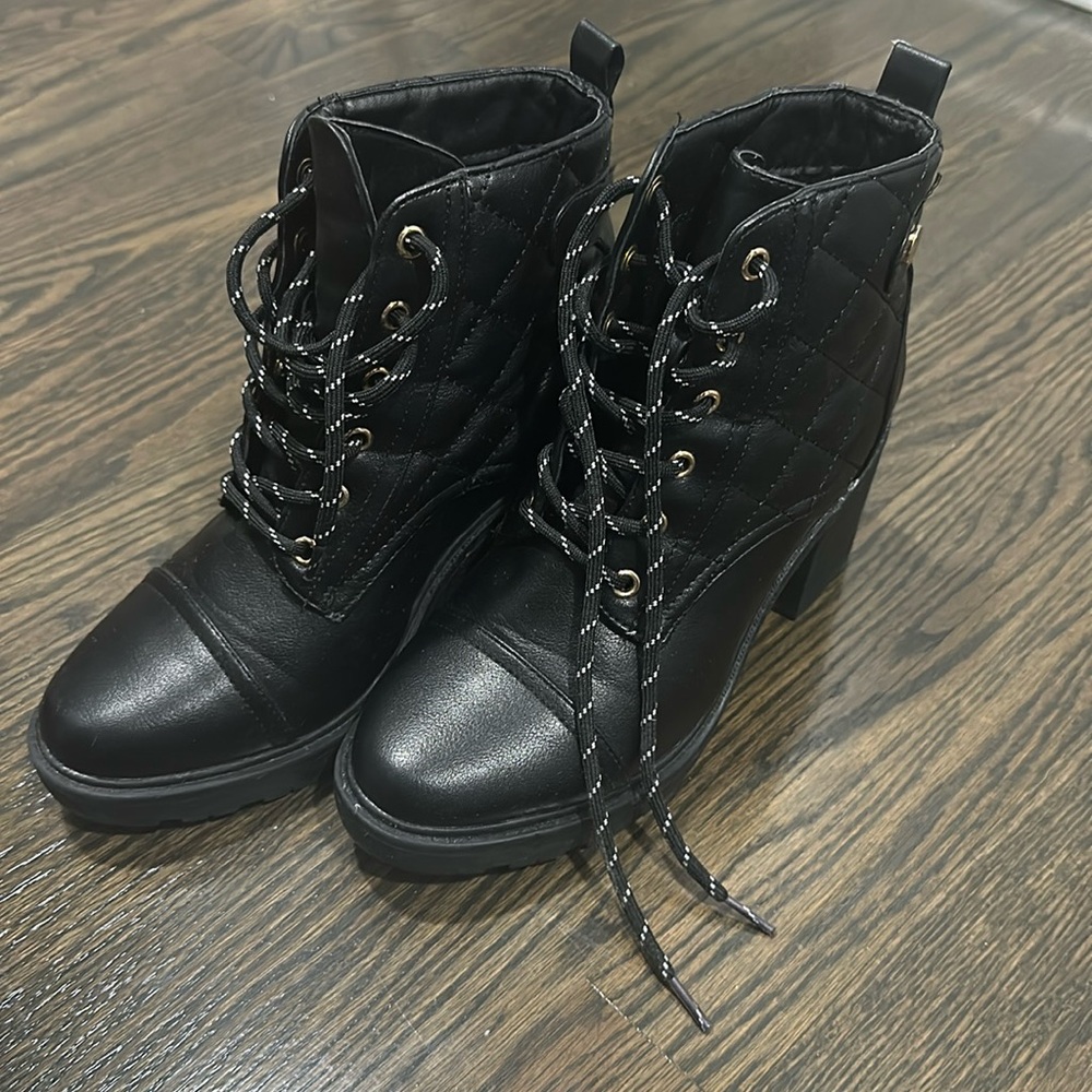 Black quilted lace up booties.